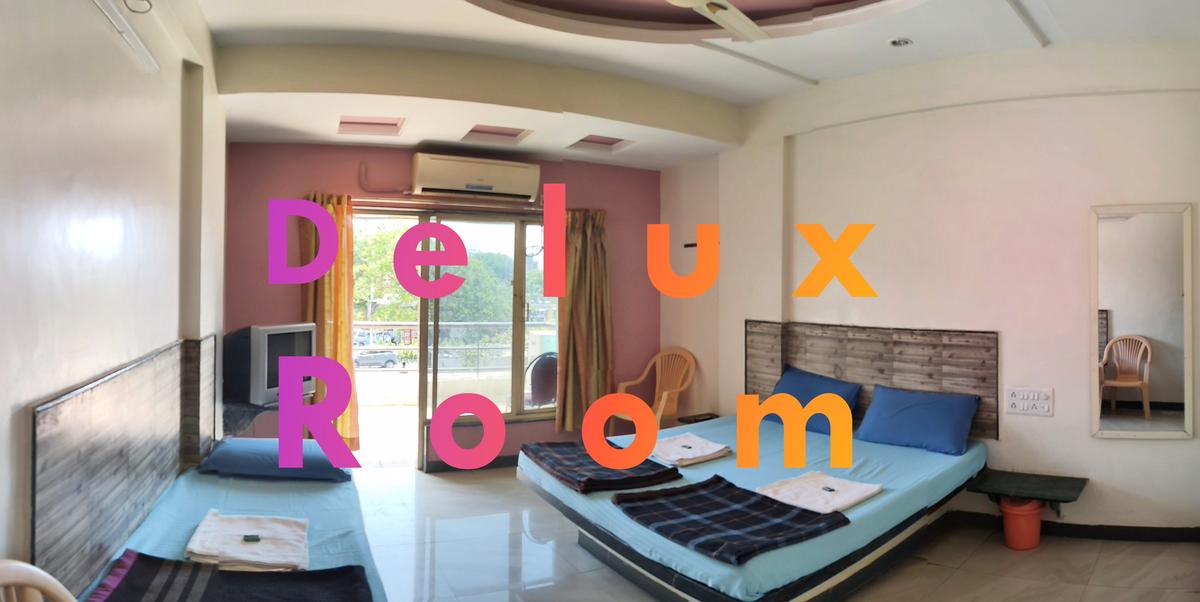 Delux room at Hotel Swaraj Delux Shirdi - spacious budget room with AC