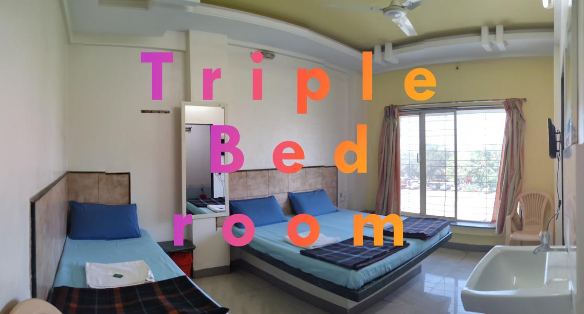Triple bed room at Hotel Swaraj Shirdi - family hotel near Sai Baba Temple walking distance